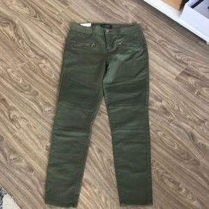 Olive Moto skinny jeans.